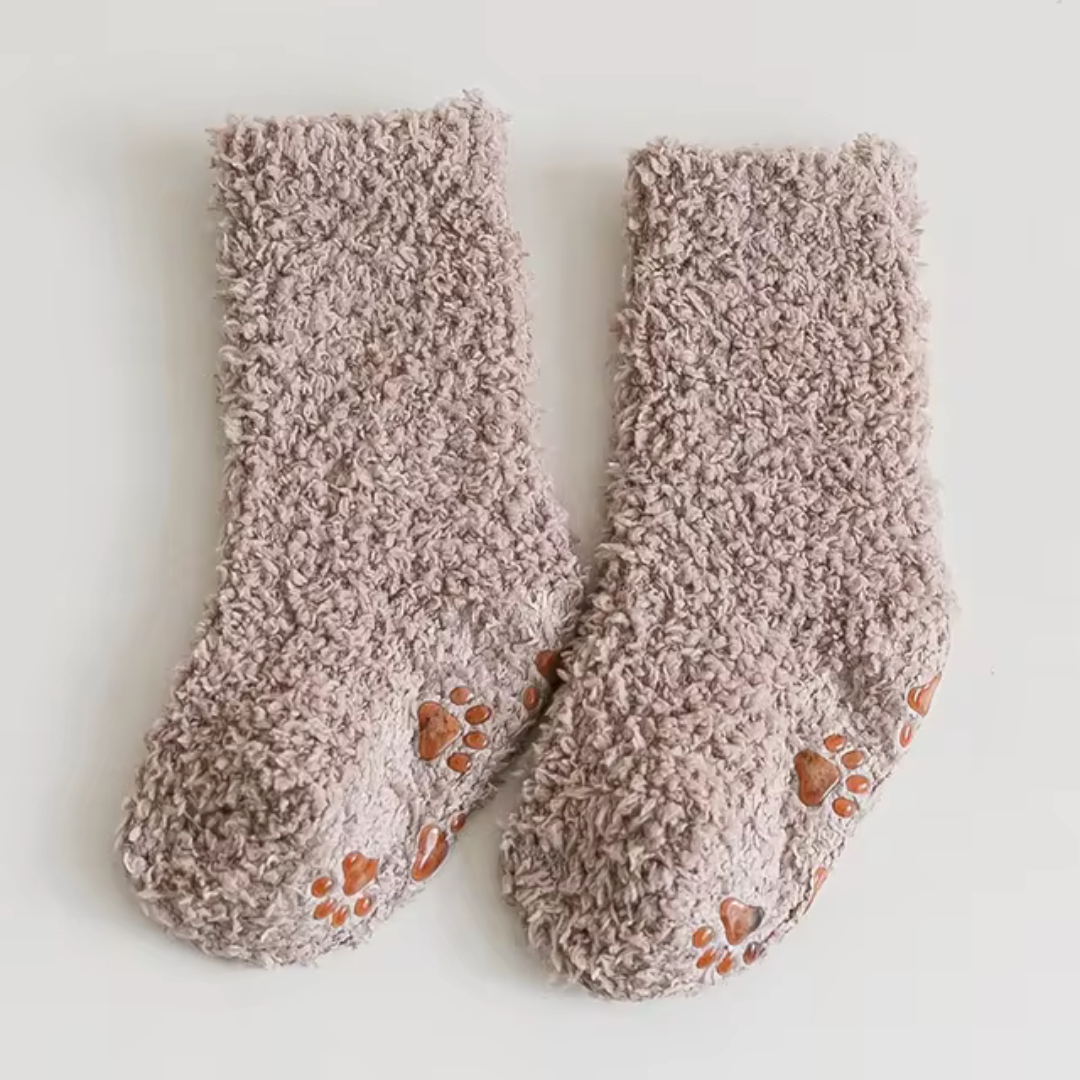 Khaki fleece socks with orange paw-print sole details