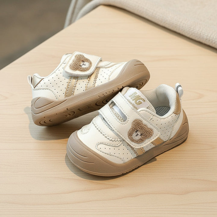 Two khaki-accent bear sneakers showing the side detail and sole