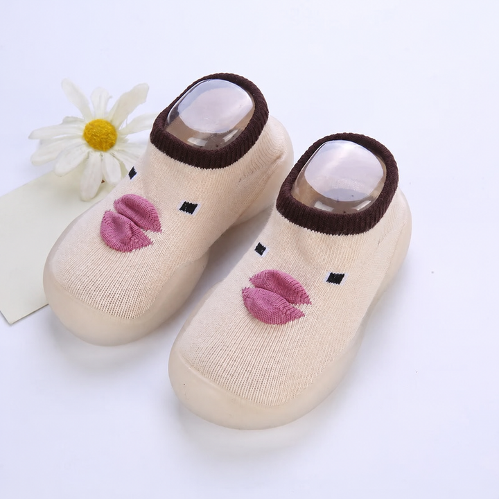 Beige sock shoes with purple duck beaks and dark brown cuffs