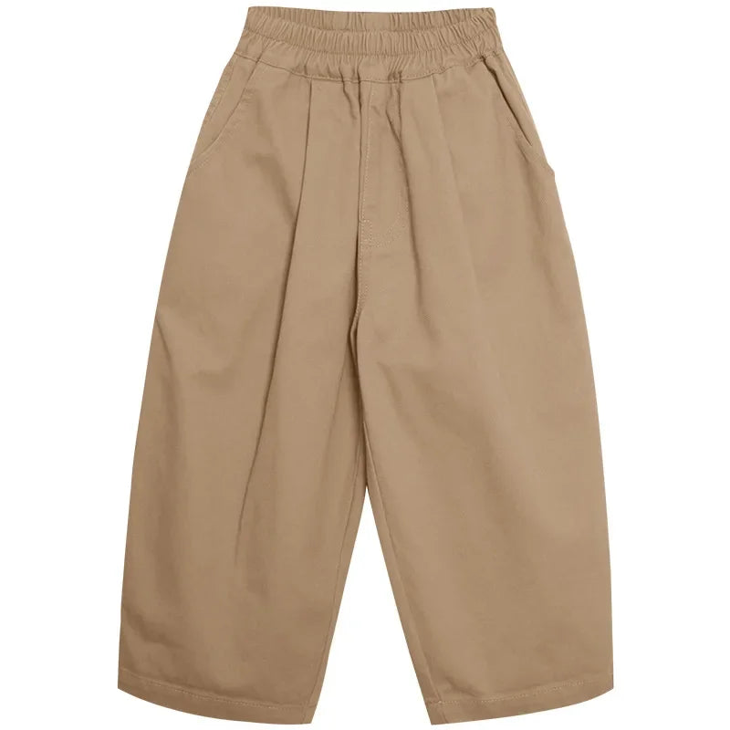 Khaki wide-leg pants laid flat, showing the gathered elastic waistband and roomy legs.