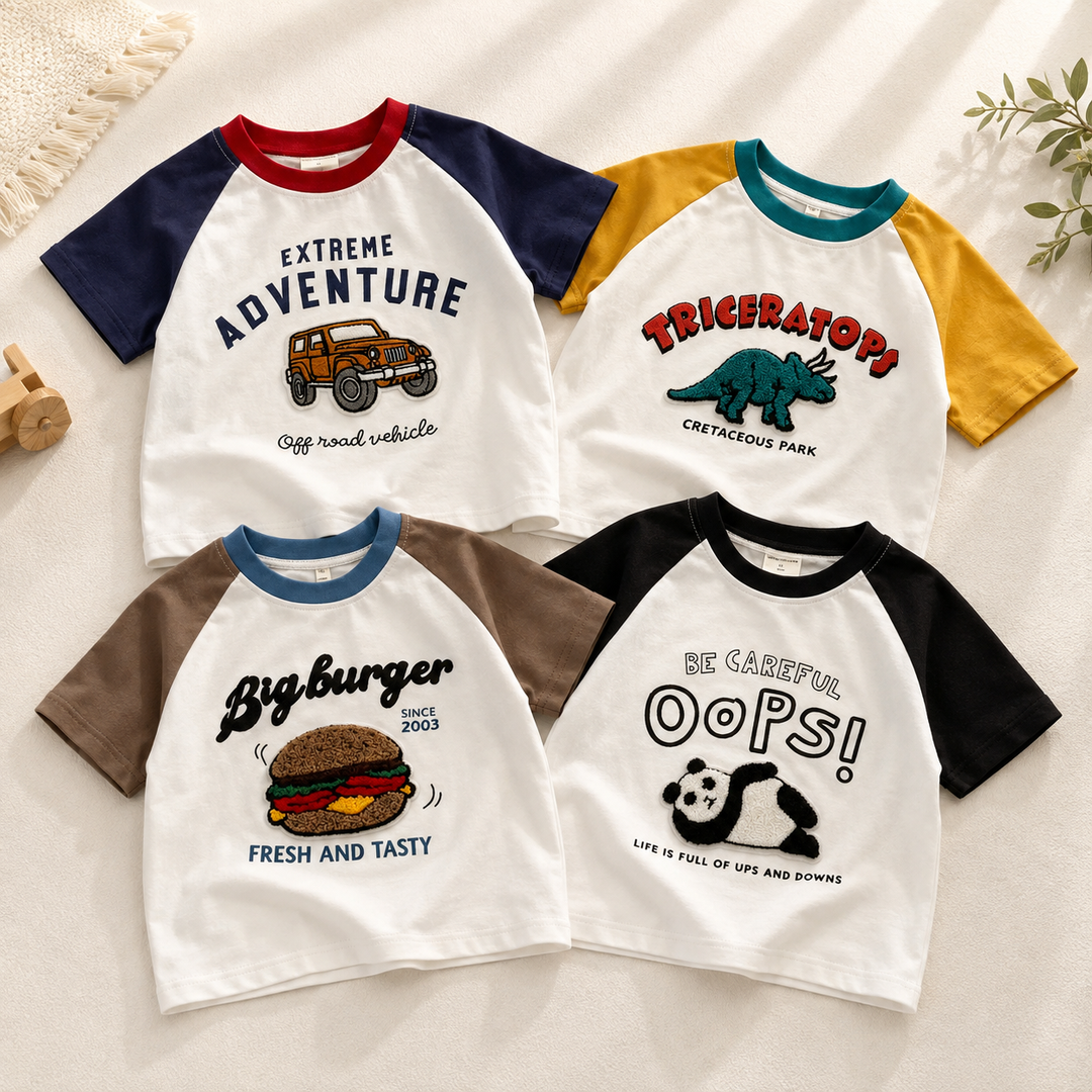 Four white kids' T-shirts with contrasting sleeves and truck, triceratops, burger, and panda prints