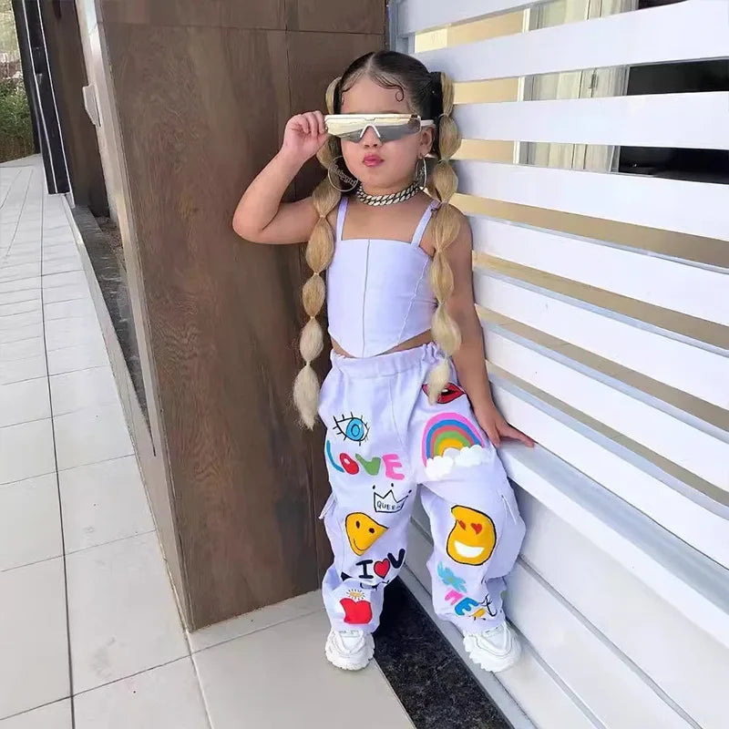 White two-piece outfit with a square-neck tank top and multicolored graphic pants