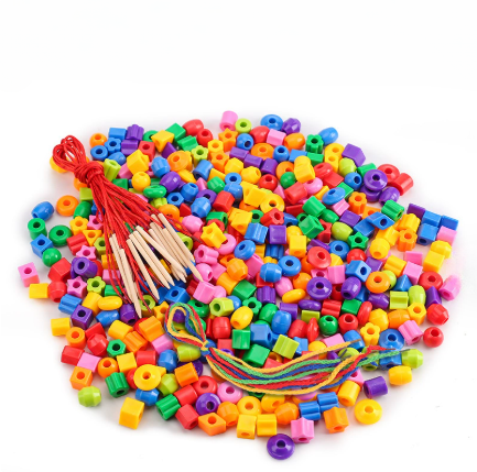Assorted colorful lacing beads with bundled cords and wooden threading tips