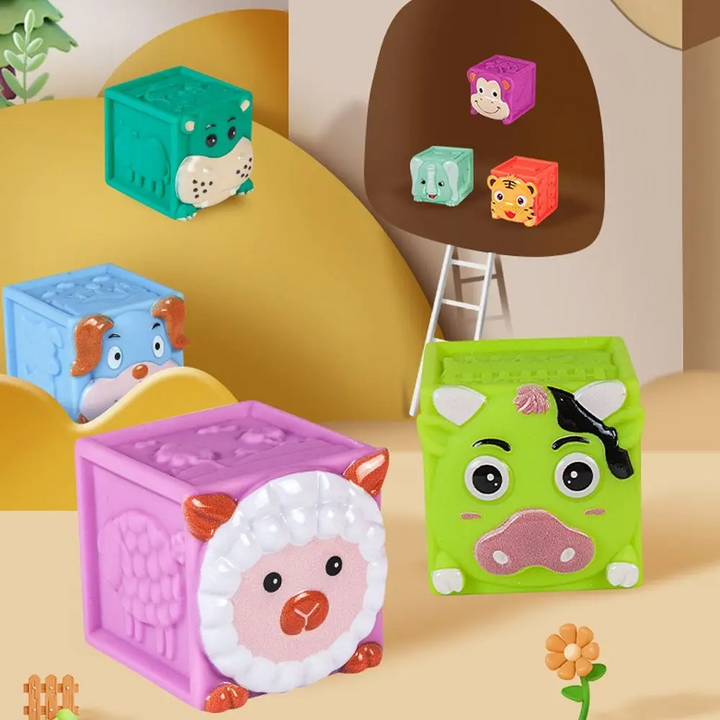 Purple lamb, green calf and blue puppy blocks in a woodland-themed display