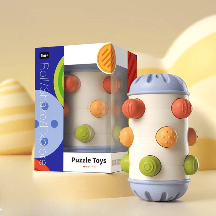 Large blue-ended sensory roller with multicolored textured buttons beside its box