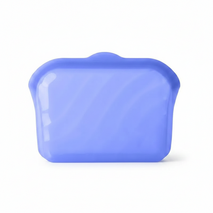 Large blue silicone food storage bag with a closed top.