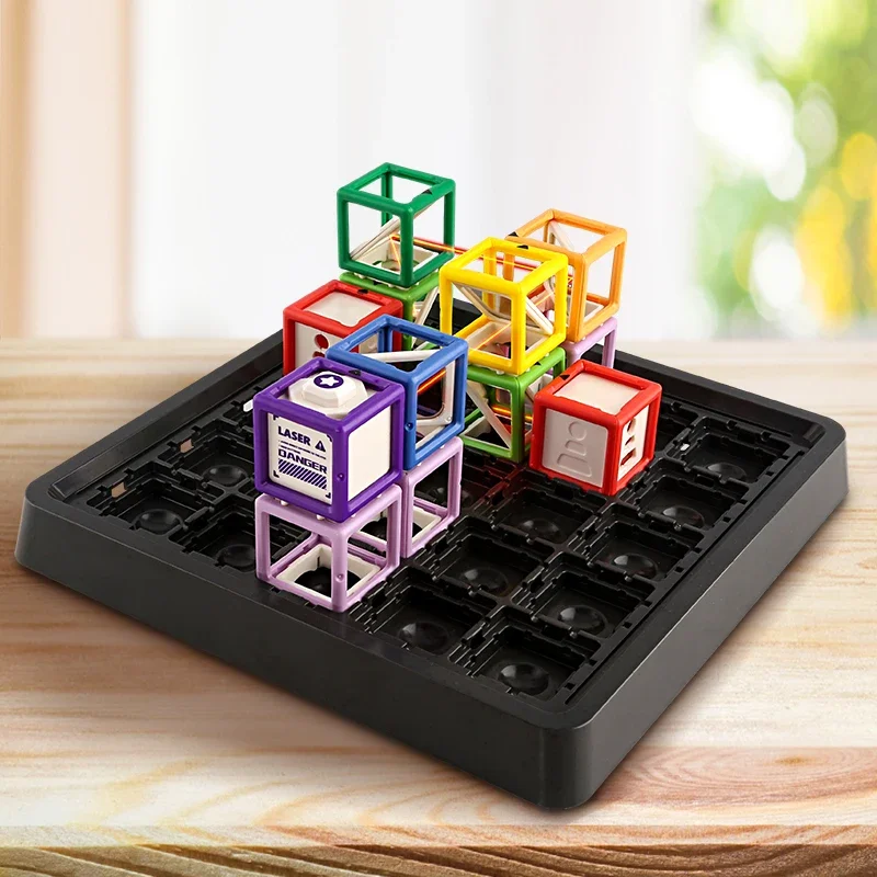 Colorful stacked towers and a purple laser block on a black maze game board.