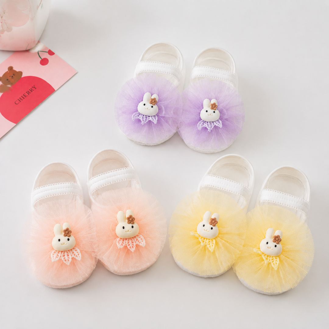 Lavender, peach and yellow baby socks with bunny accents and ruffled fronts