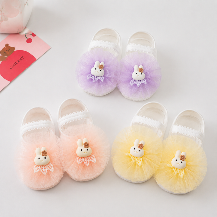 Lavender, peach and yellow baby socks with bunny accents and ruffled fronts