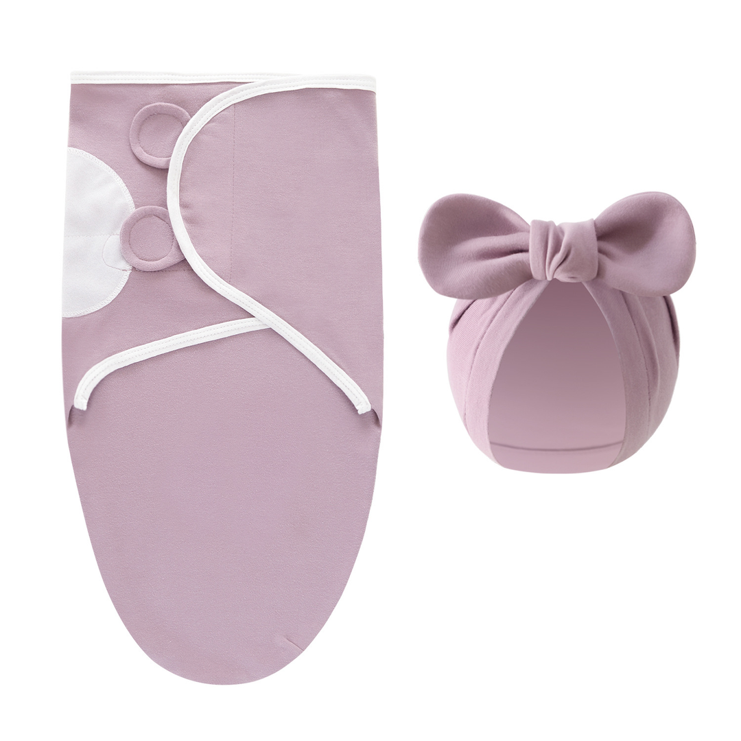 Lavender swaddle blanket with white edging and a matching bow hat