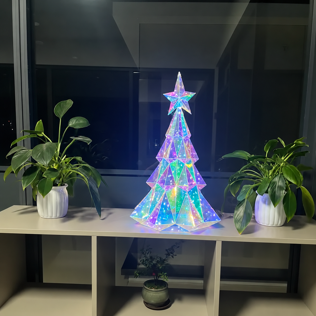 Illuminated LED Christmas tree on a shelf between potted plants at night