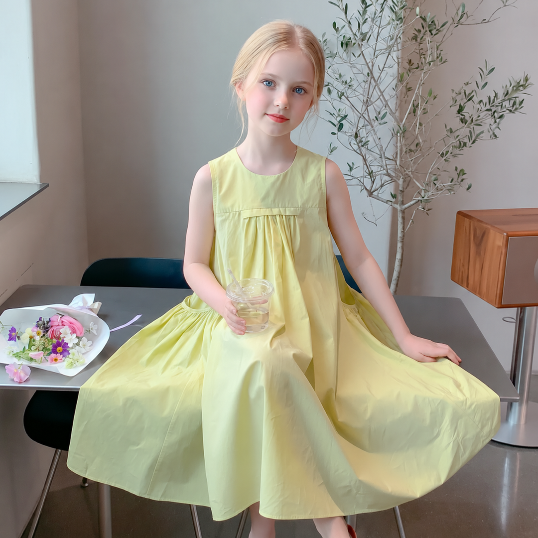 Girl wearing the yellow sleeveless dress with its full skirt spread to the side