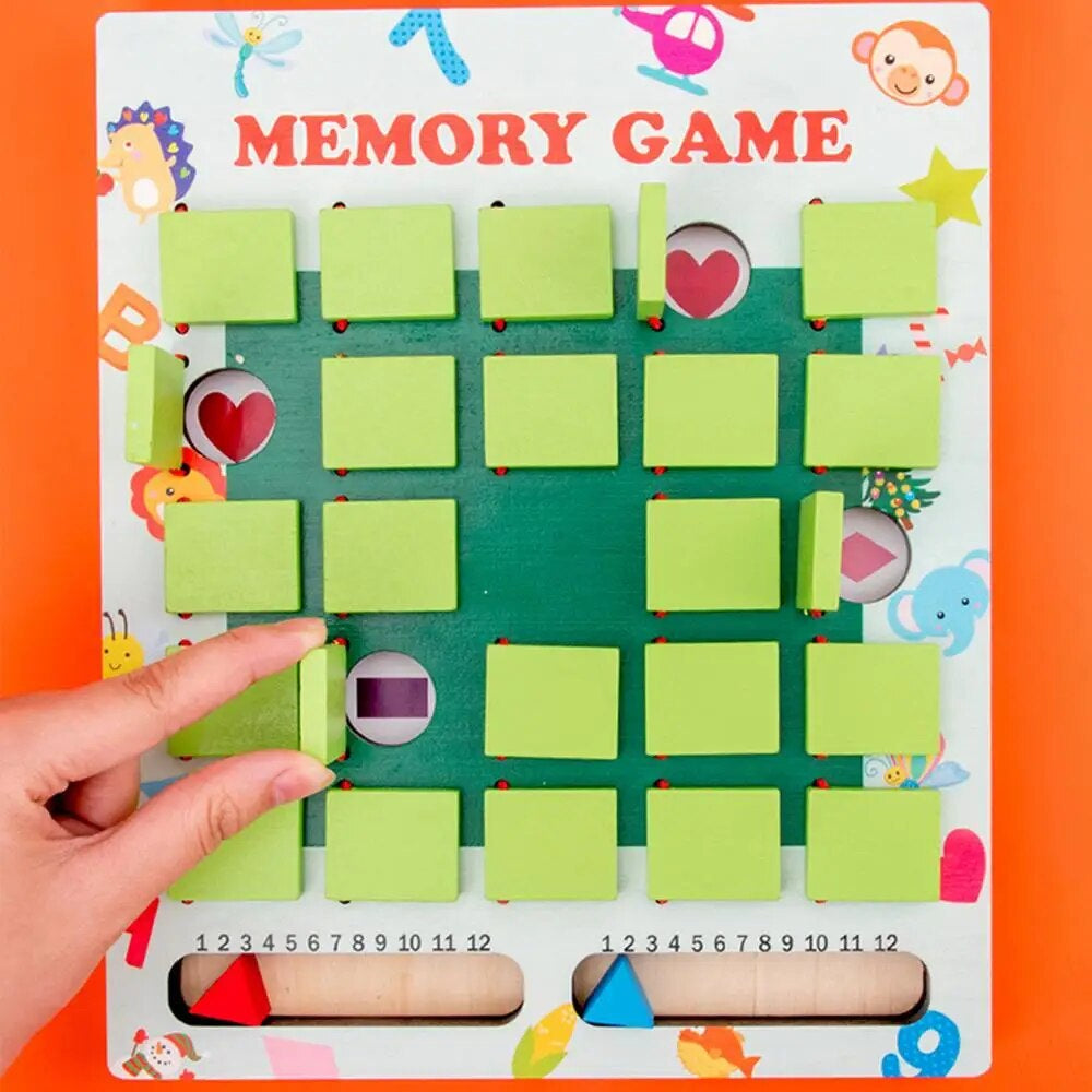 Fingers lifting a green cover to reveal a picture on the memory game board.