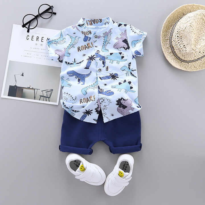 Light blue dinosaur-print button-front shirt and navy shorts