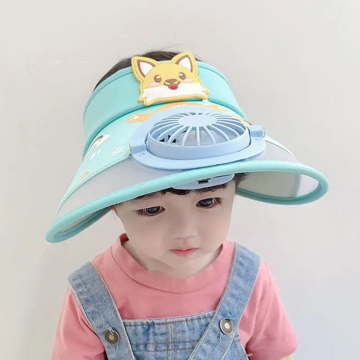 Child wearing a light blue fan hat with a cartoon dog decoration