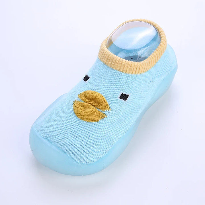 Light blue sock shoe with a raised yellow duck beak, contrasting cuff, and matching sole