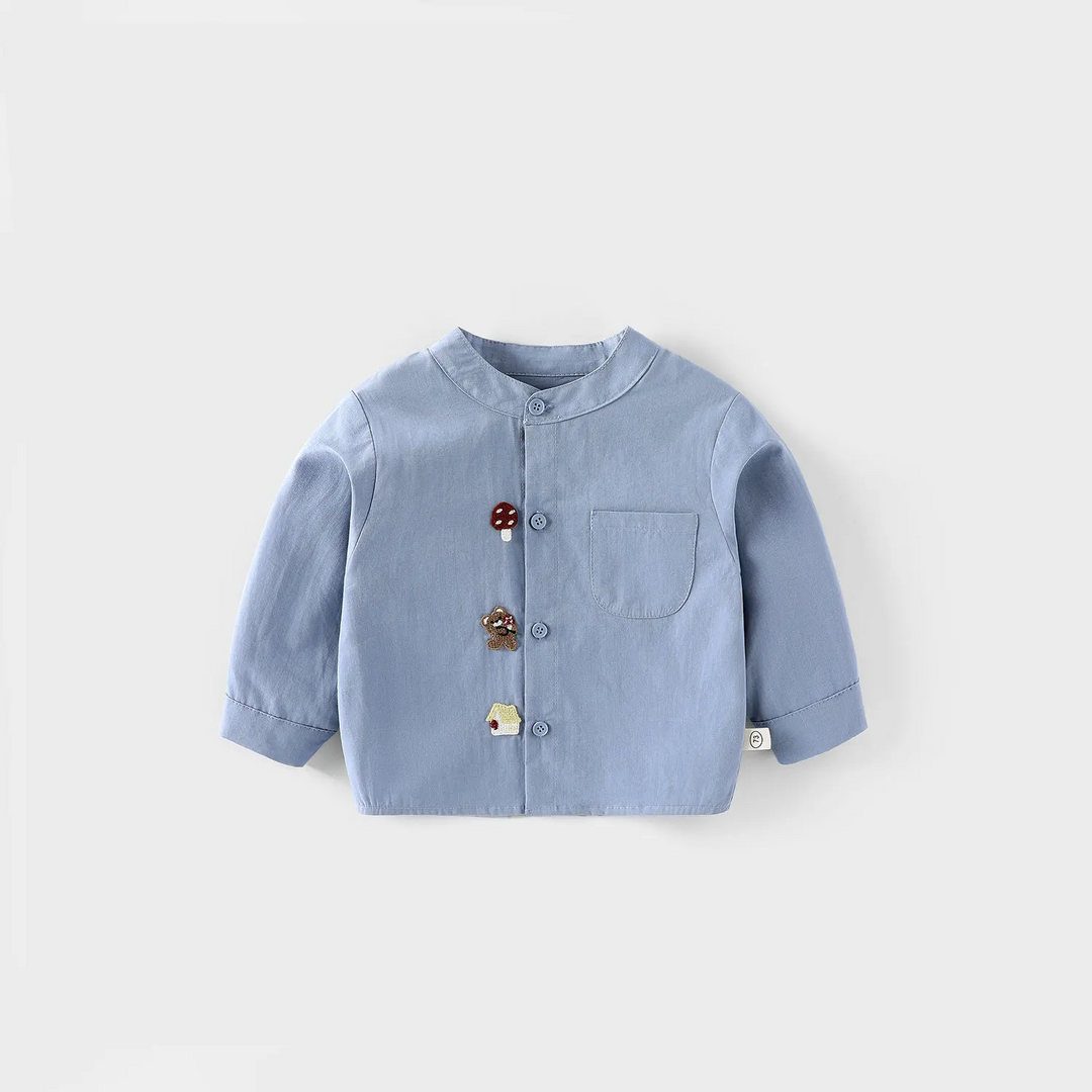 Light blue button-front shirt with a chest pocket and small embroidered details.