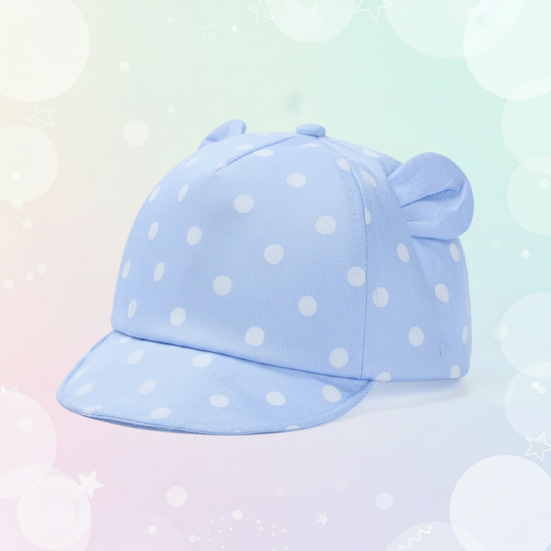 Light blue cap with white polka dots and rounded fabric ears.