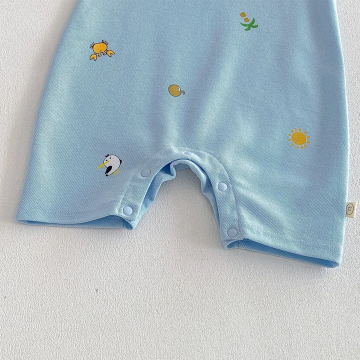 Short legs and bottom snap placket on a light blue printed baby romper