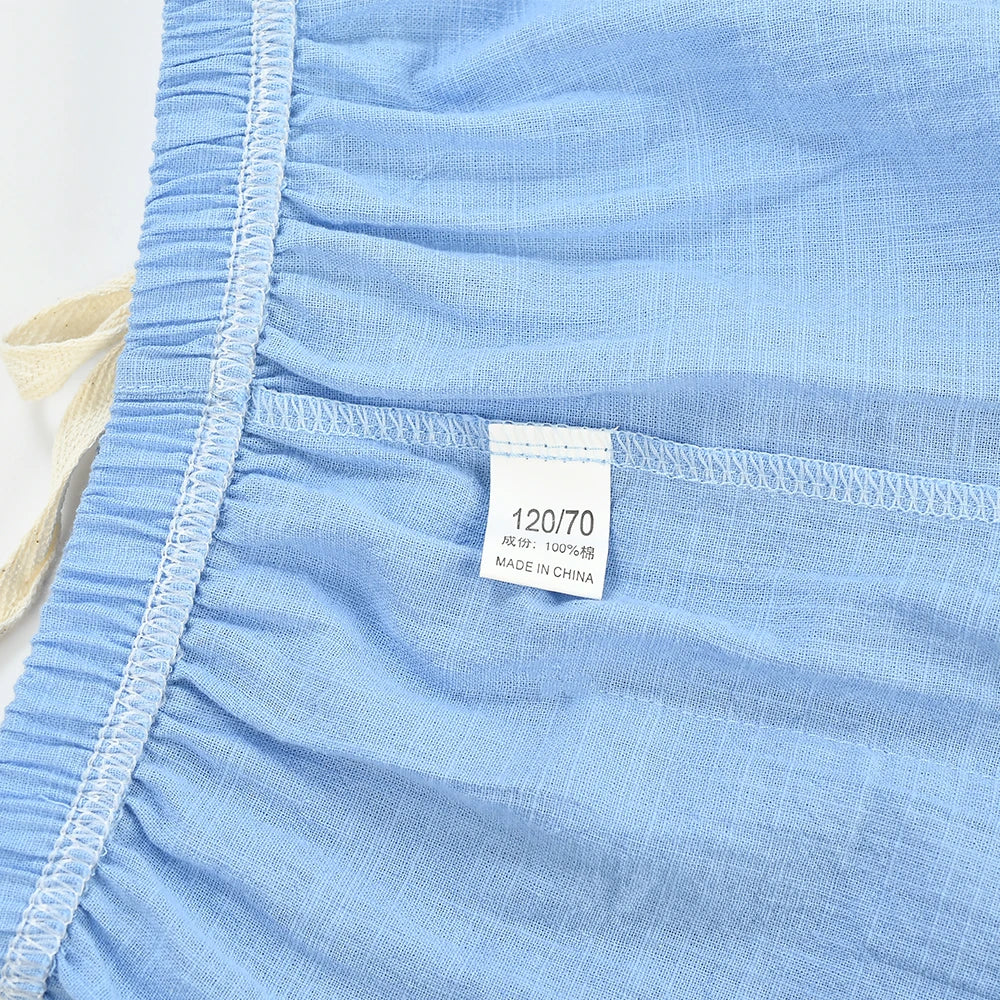 Inside waistband and seam stitching of light blue kids&