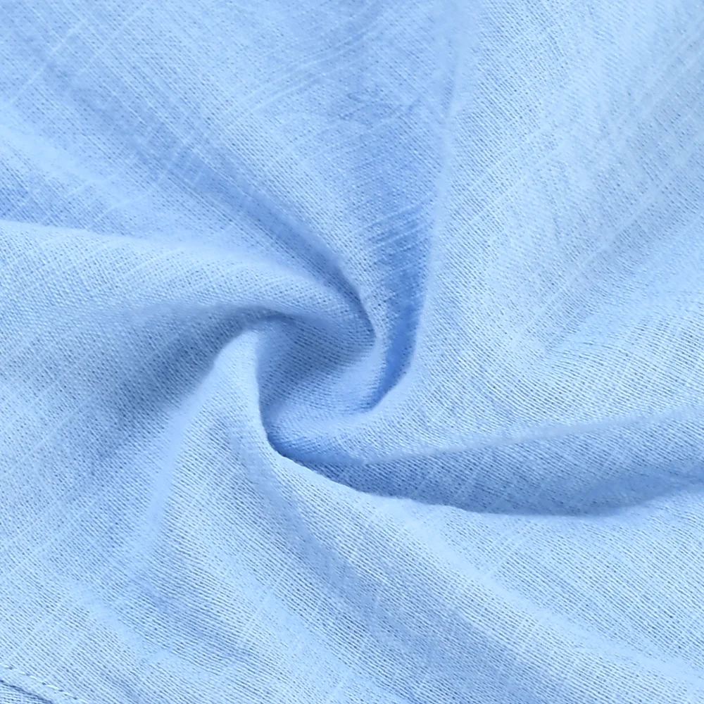 Close-up of the woven texture of light blue shorts fabric