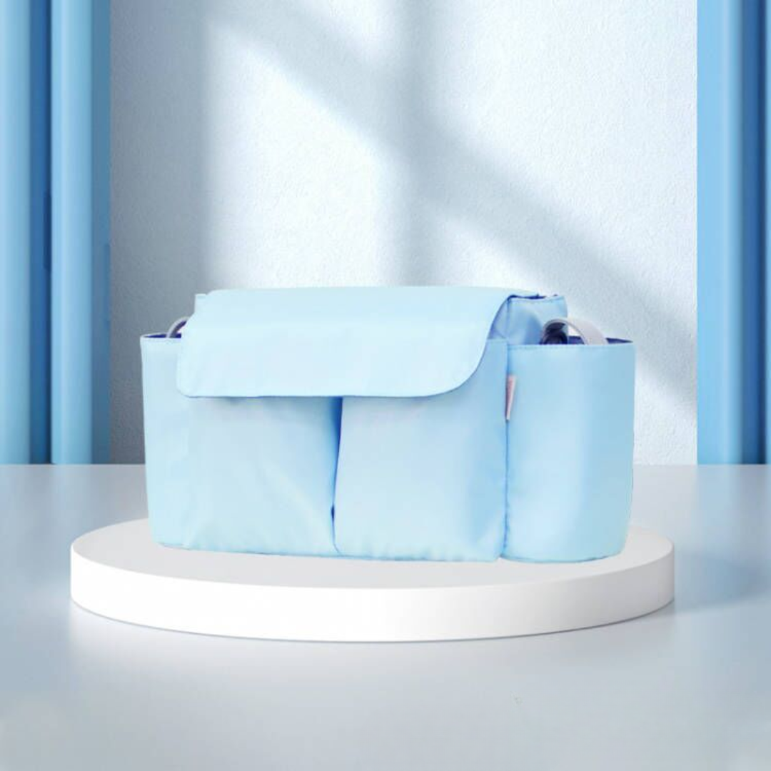 Light blue stroller organizer with a front flap and side bottle holders