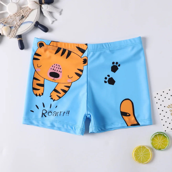 Light blue swim trunks with an orange tiger, black paw prints, and an elastic waistband.