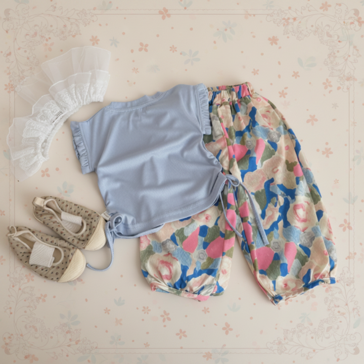 Light blue sleeveless top with multicolored printed pants