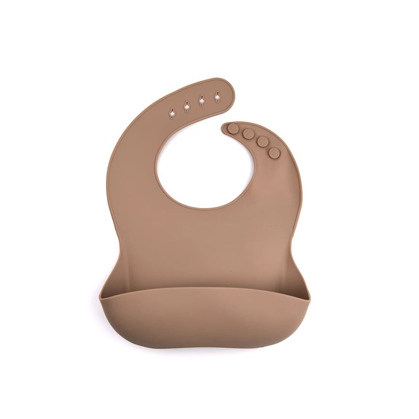 Light brown silicone bib with an adjustable neck closure and open front pocket.