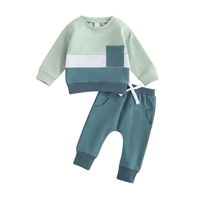 Light green sweatshirt with a white stripe, blue-green pocket, and matching blue-green joggers
