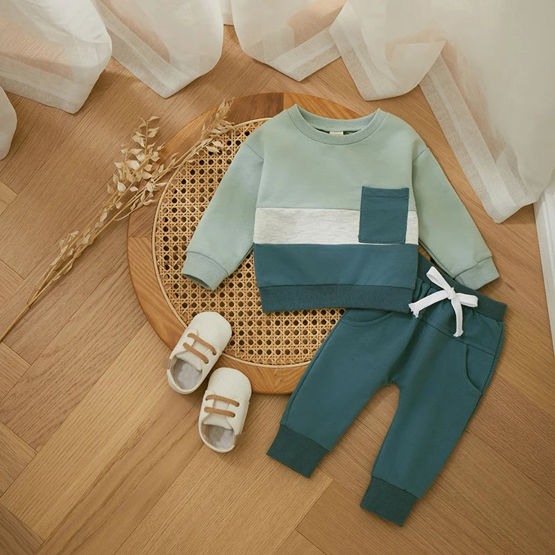 Light green colorblock sweatshirt with blue-green joggers and a white drawstring