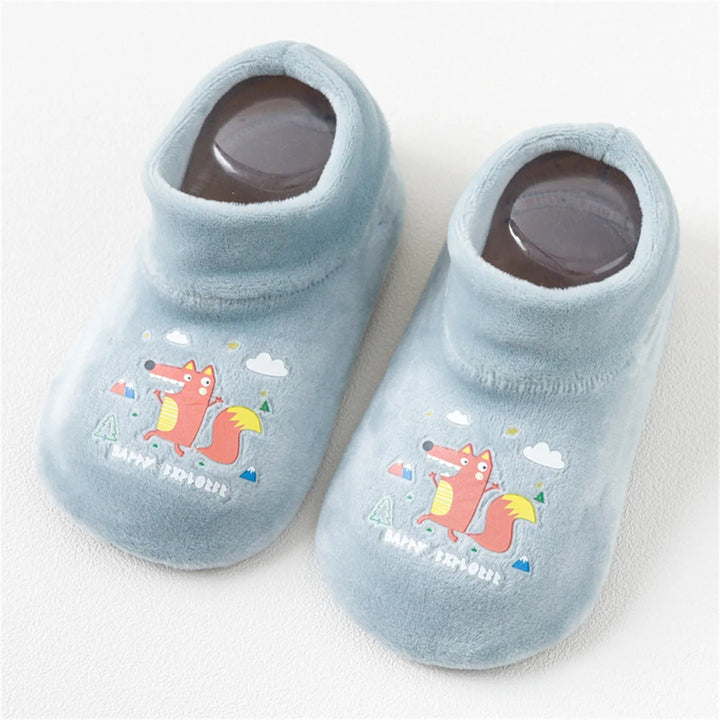 Light green sock shoes with fox prints and rounded toes
