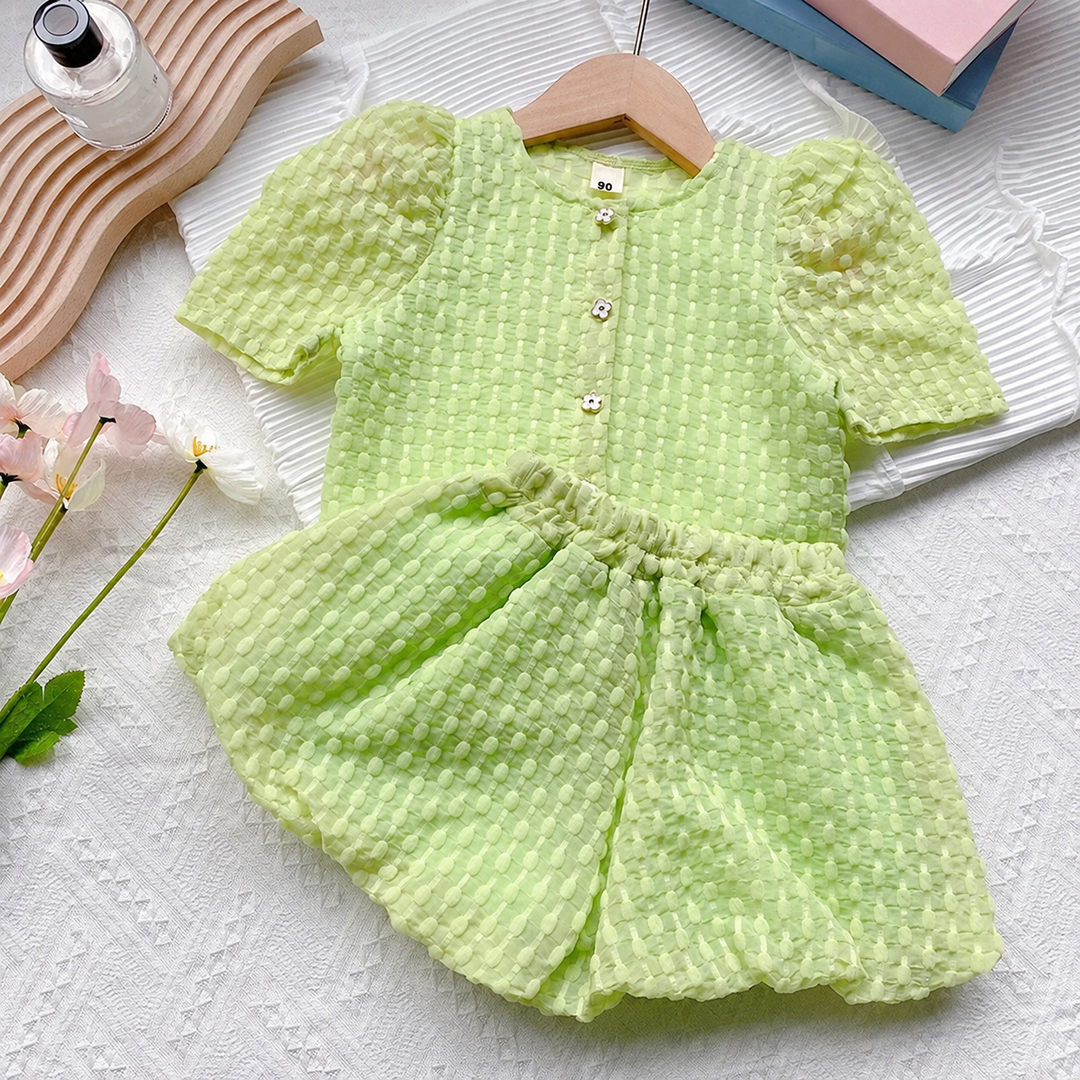 Light green textured puff-sleeve button-front top with matching shorts