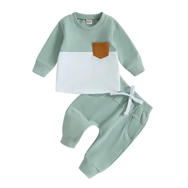 Light green and white sweatshirt with a tan pocket paired with light green joggers