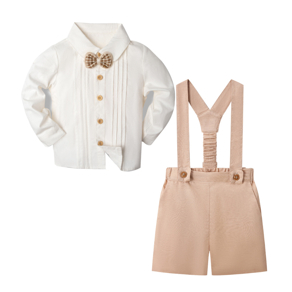 Light khaki suspender shorts with a white long-sleeve shirt and patterned bow tie