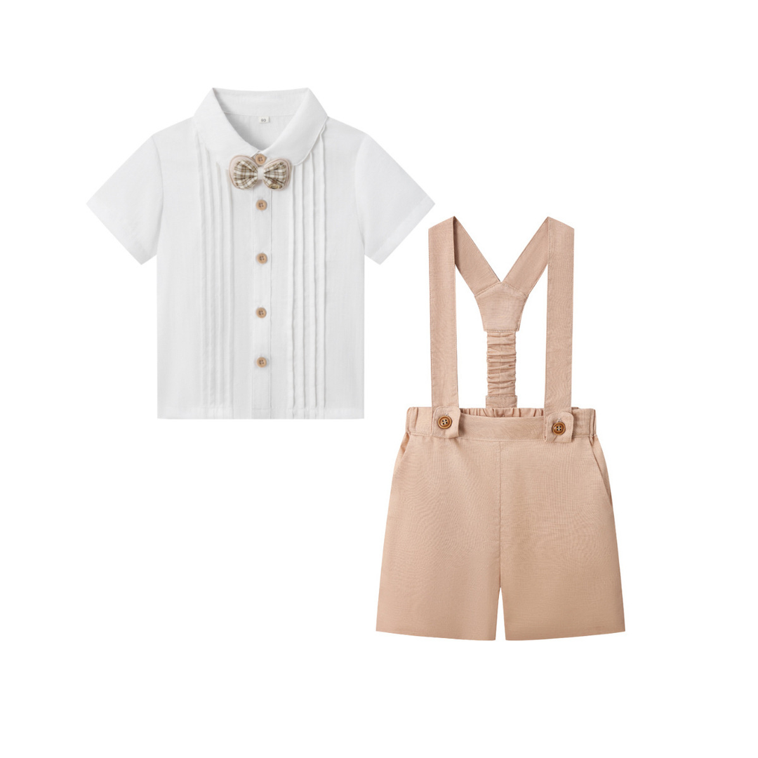 Light khaki suspender shorts with a white short-sleeve shirt and patterned bow tie