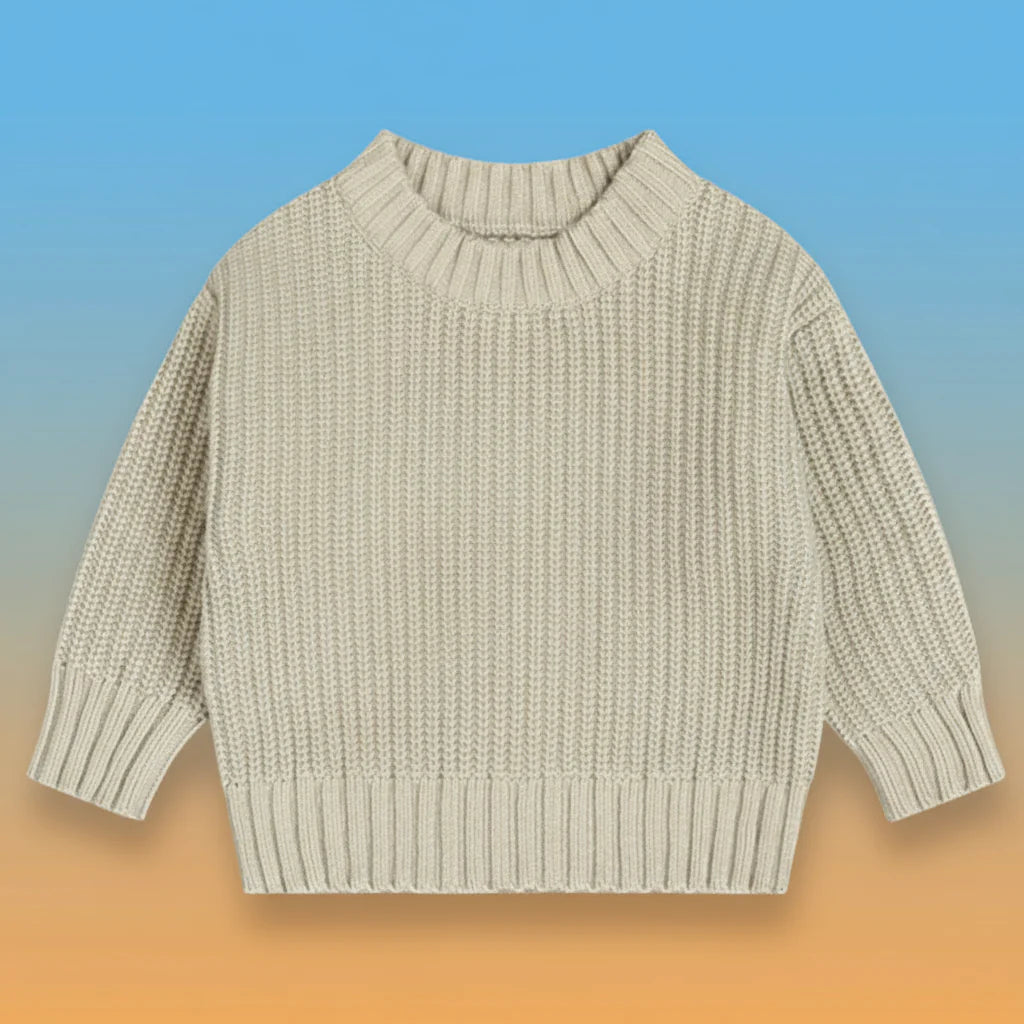 Light neutral knit sweater with a round neck and ribbed cuffs and hem.
