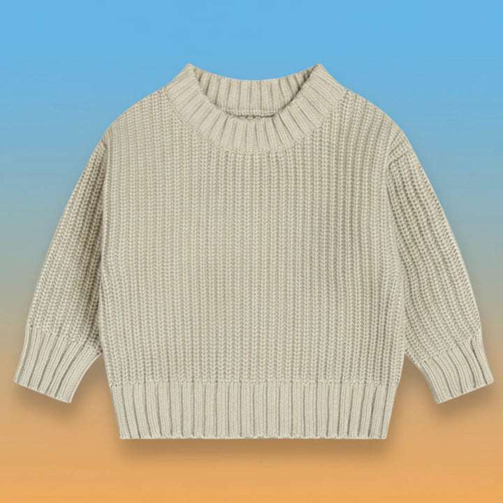 Light neutral knit sweater with a round neck and ribbed cuffs and hem.