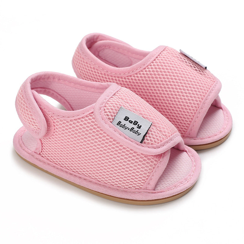 Light pink mesh baby sandals with open toes and wide adjustable straps
