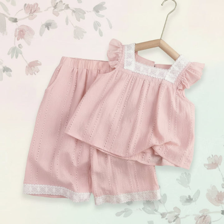 Light pink ruffle-trimmed top and matching pants with white lace accents