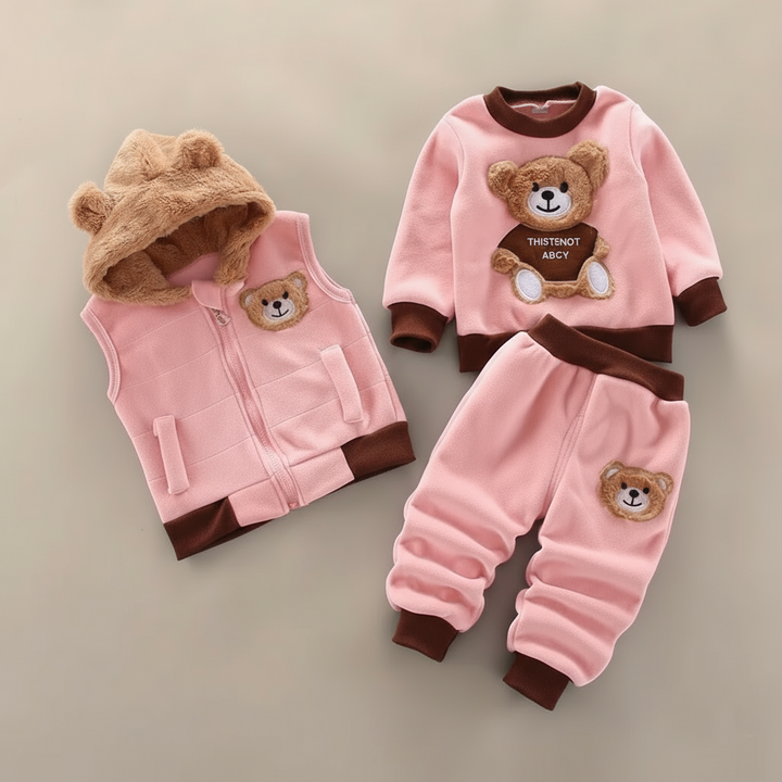 Light pink teddy-bear outfit with a tan bear-ear hood on the vest and brown trim