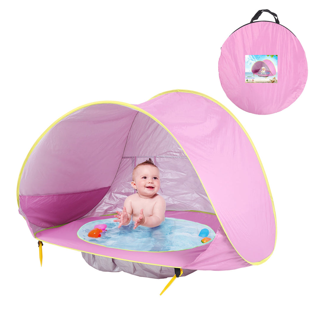 Light pink pop-up tent with a baby in the built-in bath and a matching carrying bag