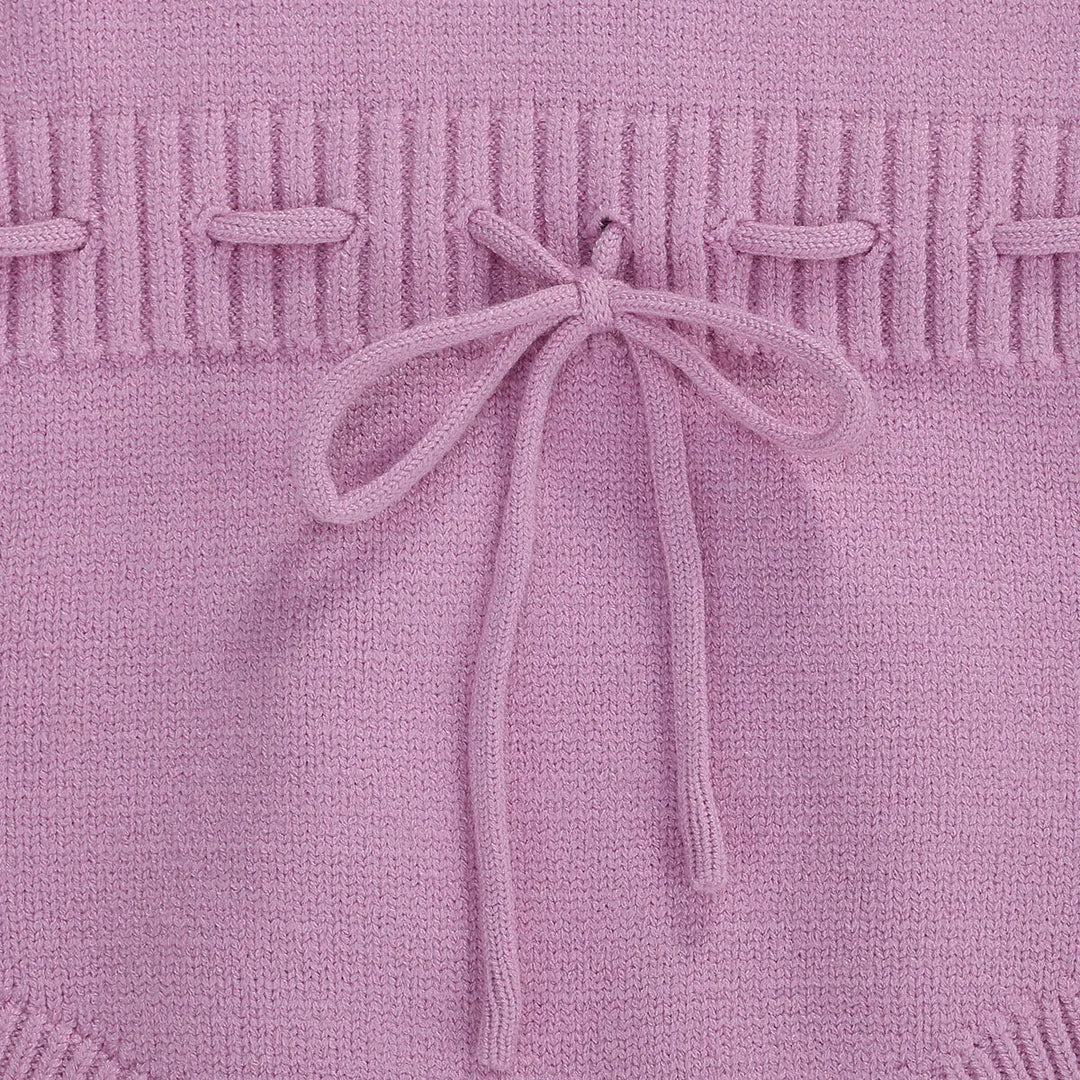 Light purple romper waist with textured knit detailing and a tied bow