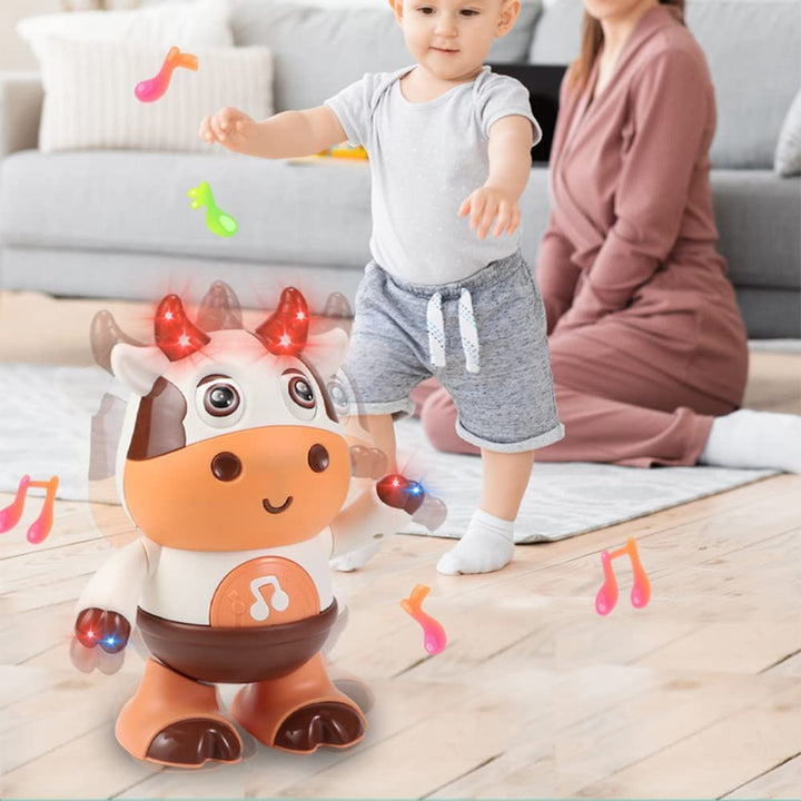 Child standing near a light-up cow toy with an adult seated nearby