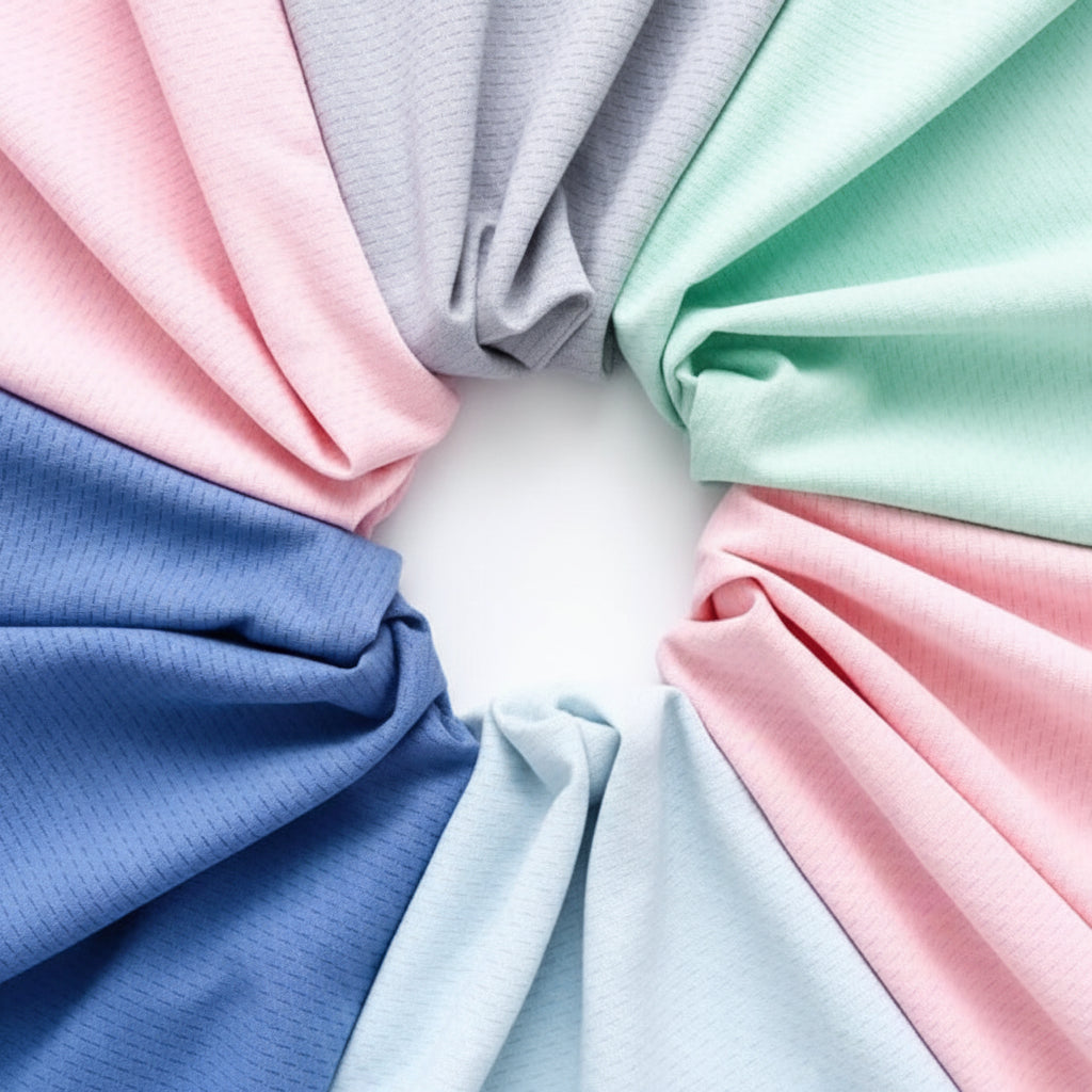 Blue, light blue, pink, gray, and mint green jacket fabrics arranged in a circle.