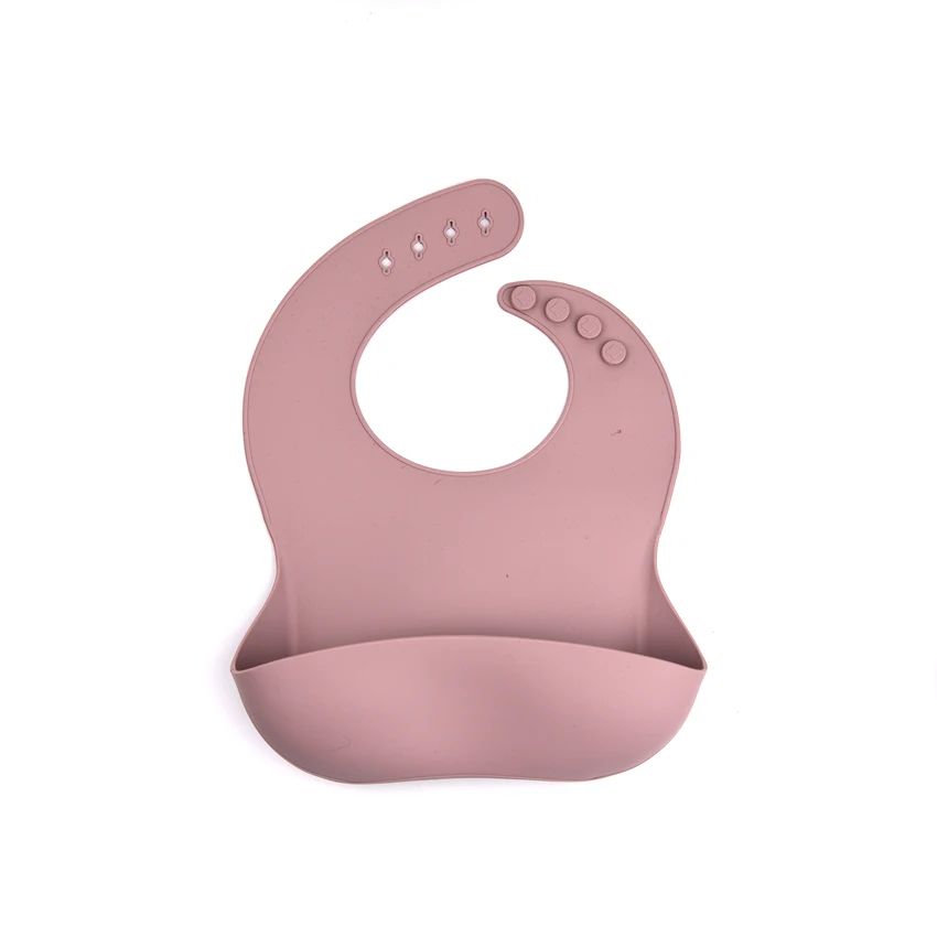 Lilac silicone bib with an adjustable snap neck and curved front pocket.