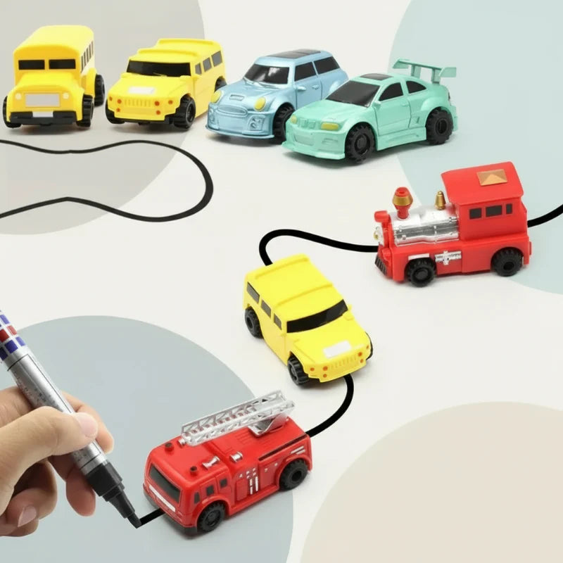 Colorful toy cars, a bus, a train, and a fire truck arranged along black tracks beside a drawing pen