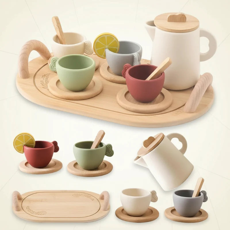 Tea set shown with a wooden tray, colorful cups, saucers, spoons, and a cream-colored pitcher