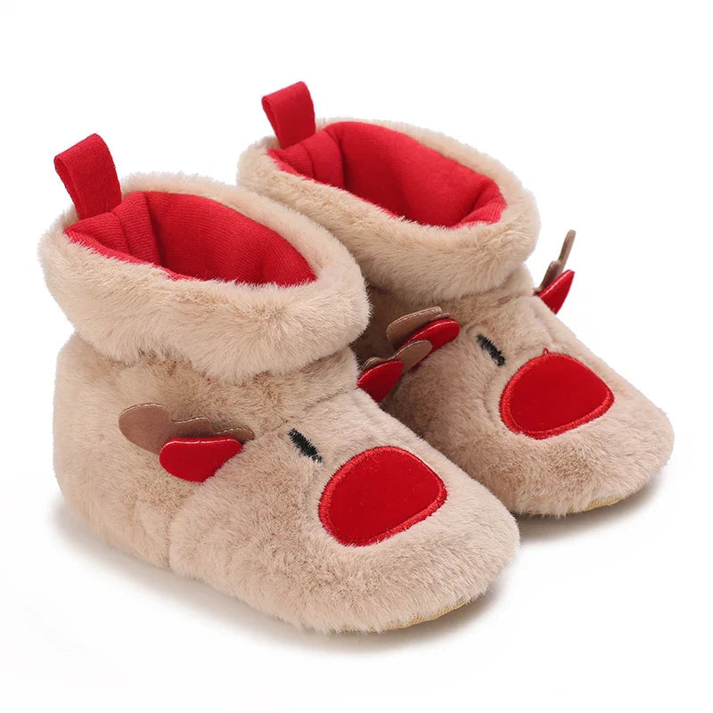 Tan plush reindeer baby slippers with red noses, red lining and folded cuffs