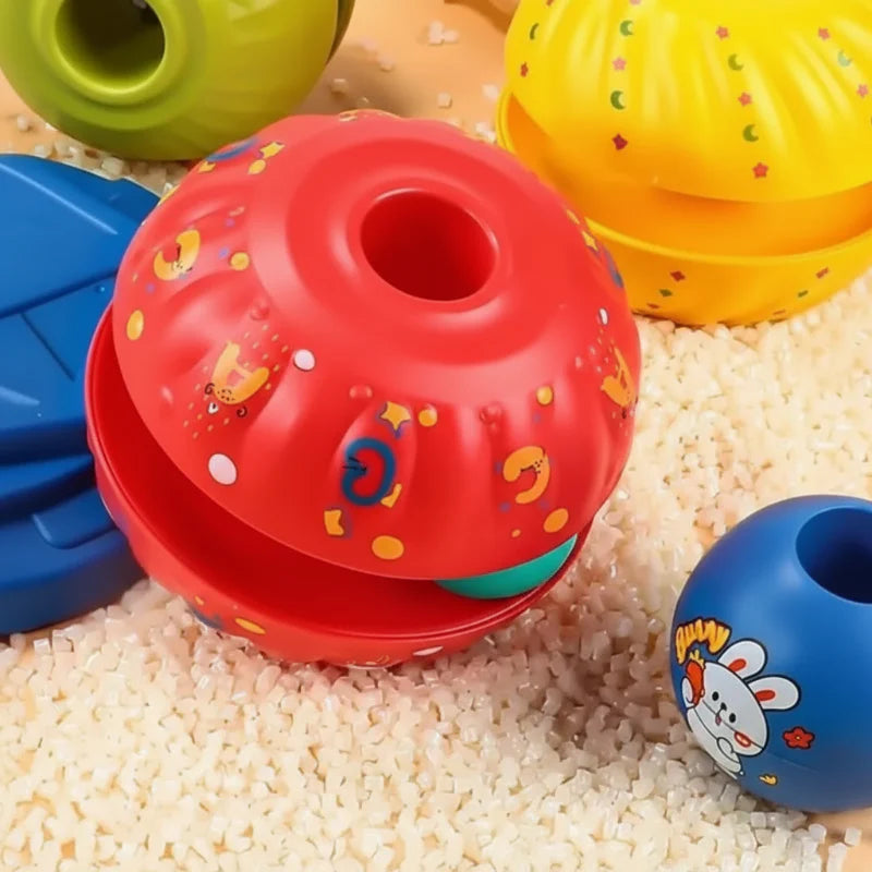 Close-up of red, yellow, green, and blue stacking pieces with patterned surfaces